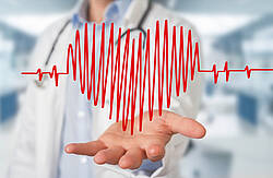 Pulskurve Pulskurve als Herz dargestellt, im Hintergrund ein Arzt